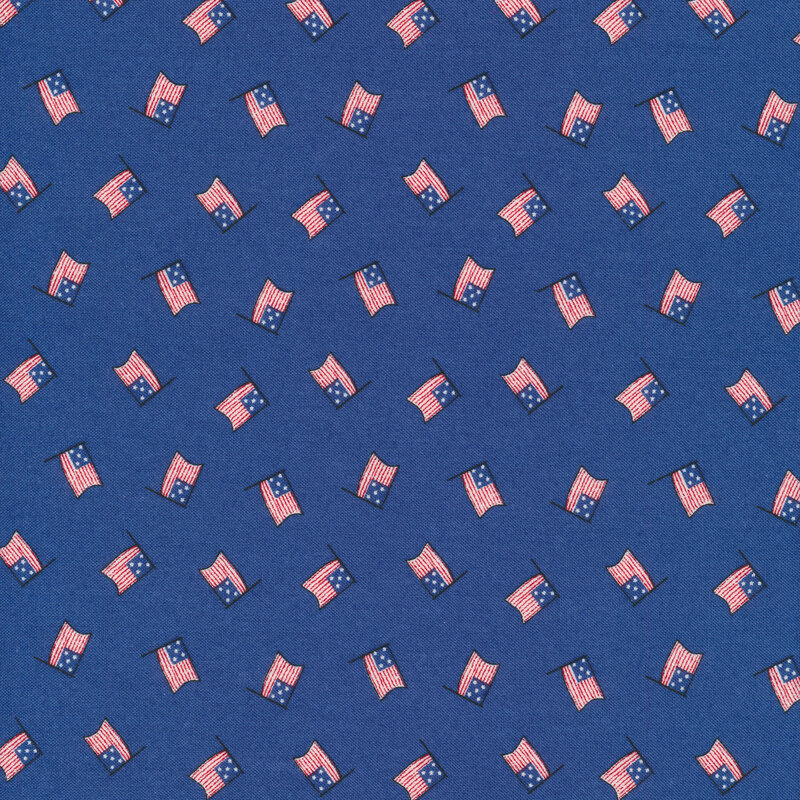 Tossed American flags on a blue background
