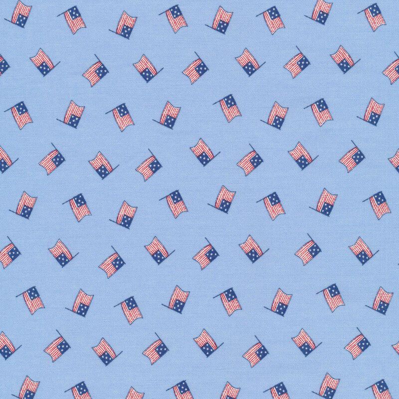 Tossed American flags on a sky blue background