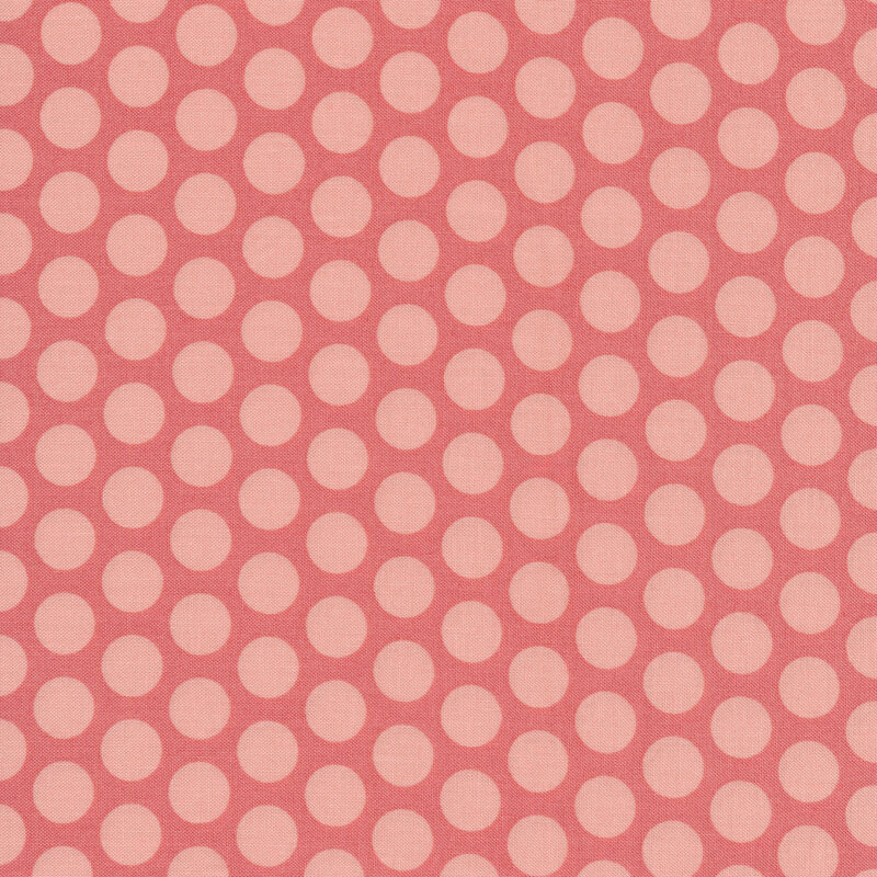Light pink polka dots on pink fabric