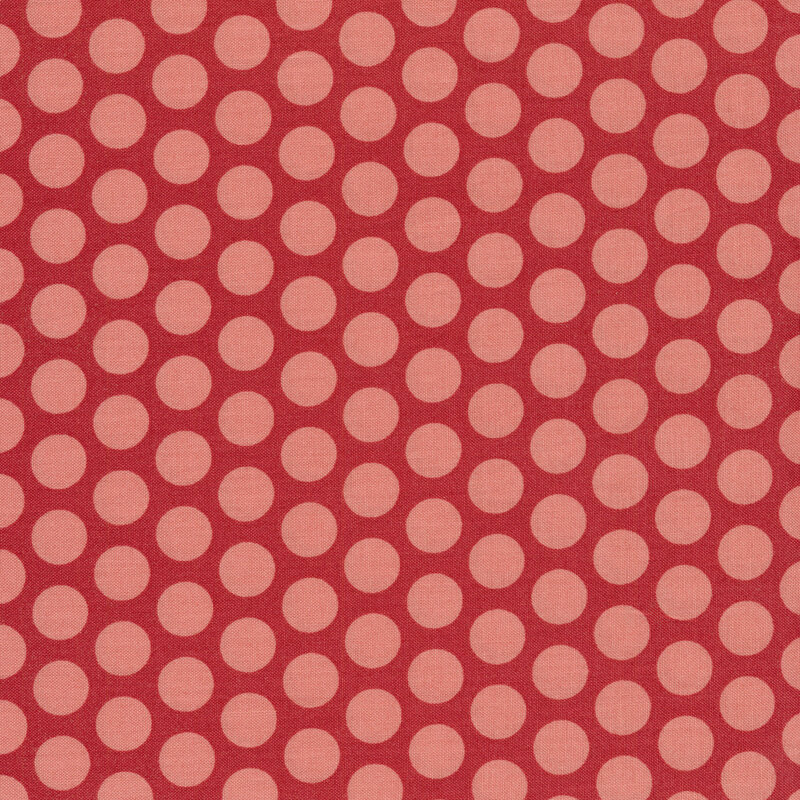 Pink polka dots on red fabric