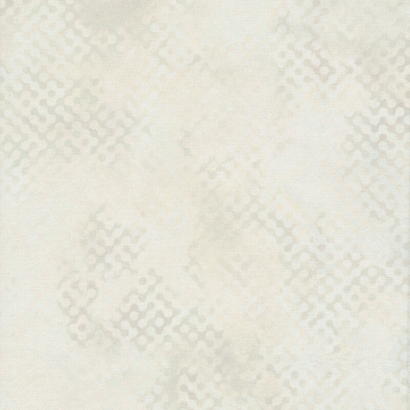 Tonal batik fabric with cream colored mottling and zig zag shapes