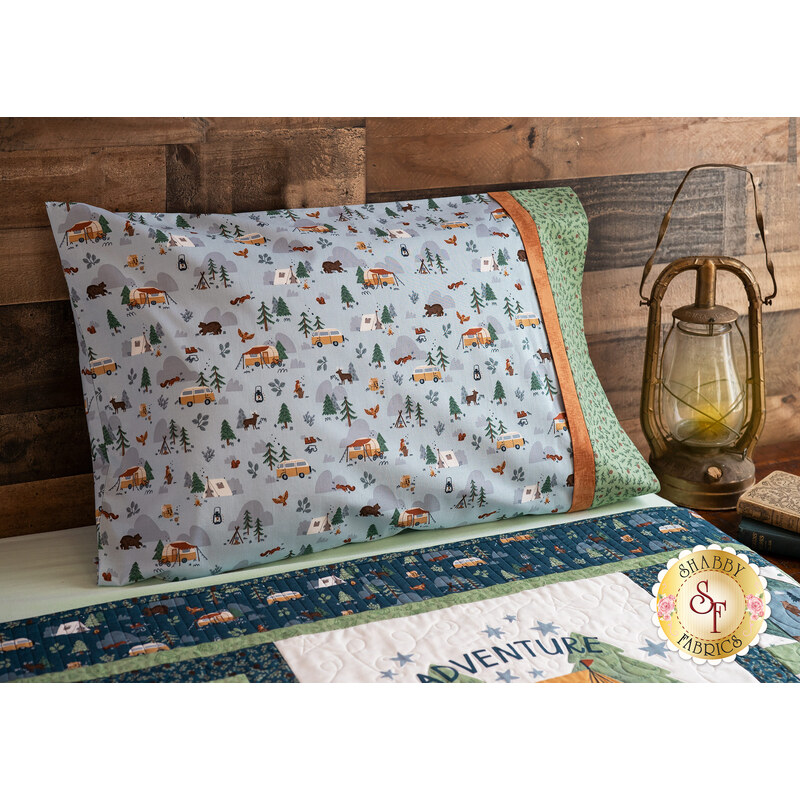 The standard size Camp Woodland pillowcase in Light Blue displayed on a bed