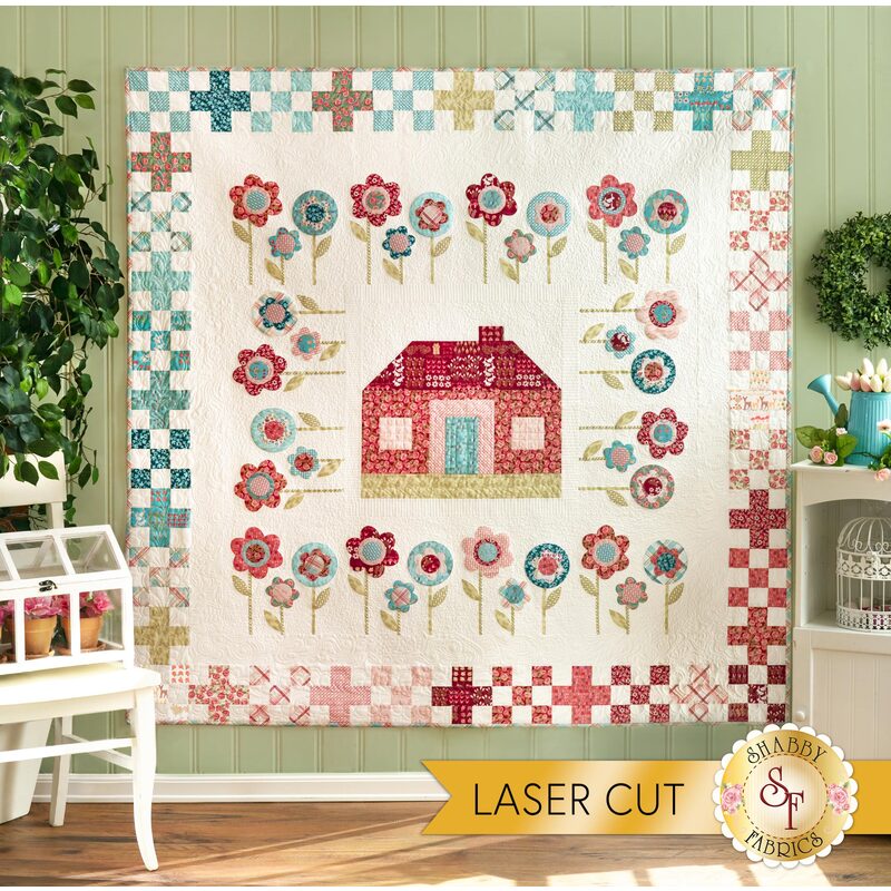 Adorable springtime farmhouse quilt displayed on a wall