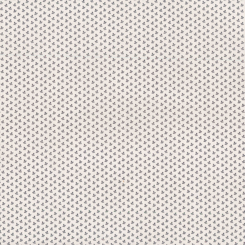 Cream shirting print fabric features tiny black floral print pattern | Shabby Fabrics