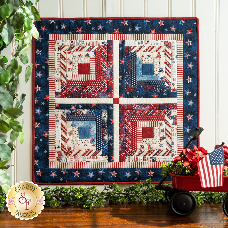 The red, white, and blue Log Cabin Wall Hanging Kit made with Liberty Lane fabrics