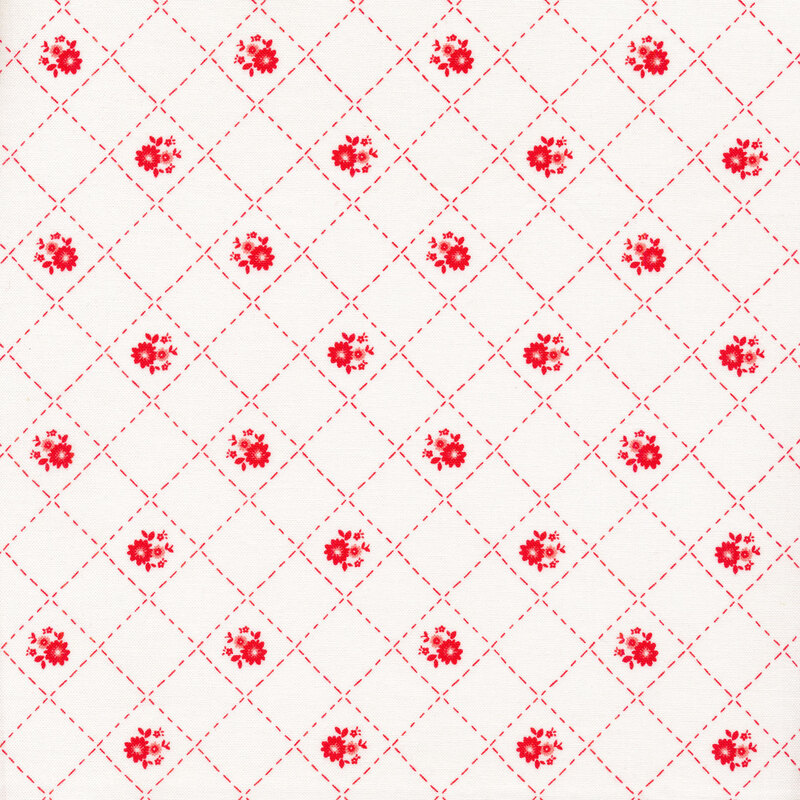 Small red dotted lattice and flowers on a white fabric background