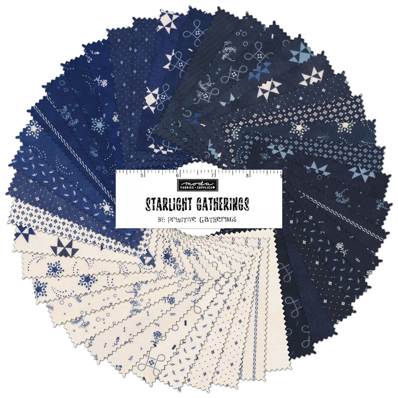 A collage of blue and white fabrics from the Starlight Gatherings Charm Pack