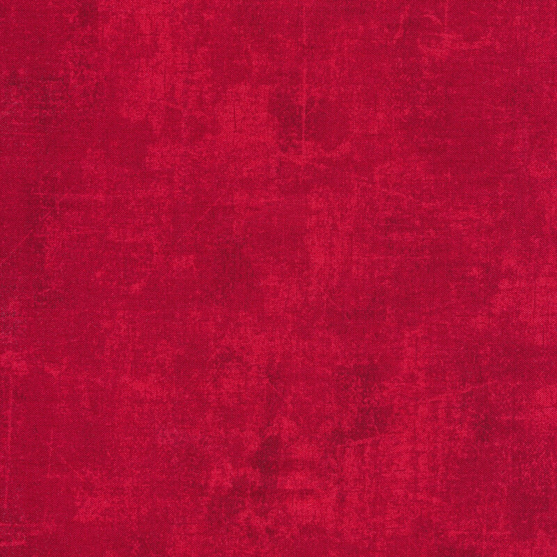 Red fabric with a mottled design and tonal cracked canvas texture