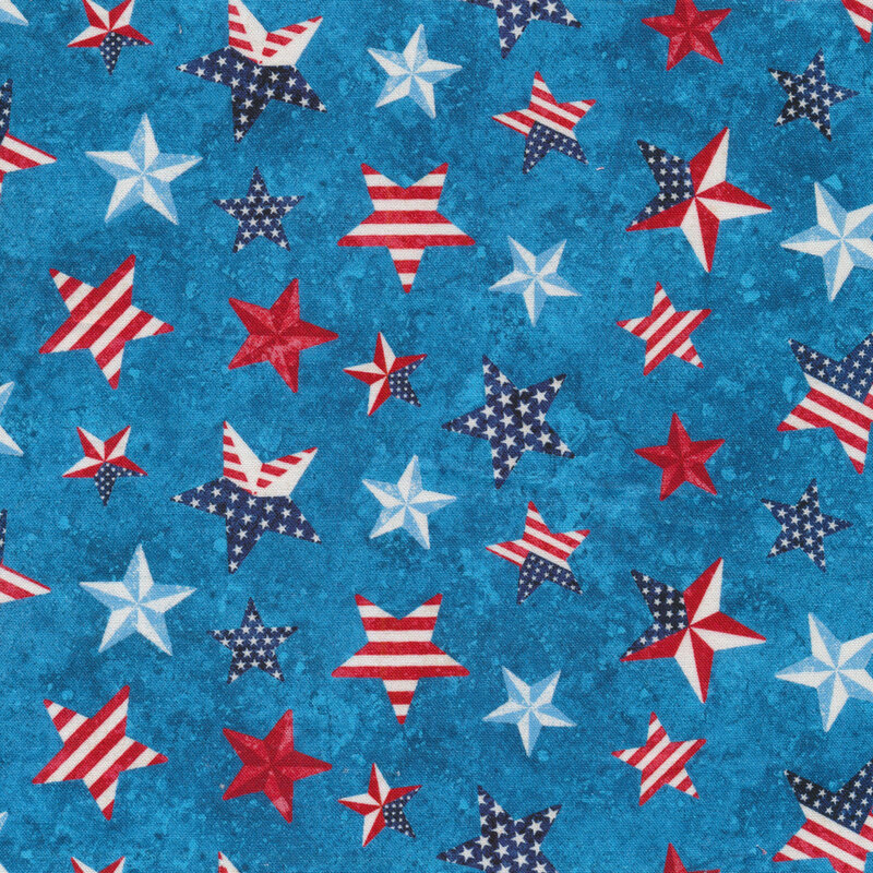 Patriotic fabric with red, white, and blue stars on a mottled blue background