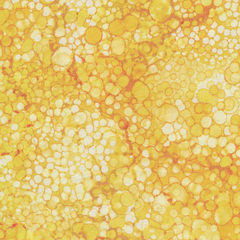 Yellow tonal marbled fabric with small circles all over
