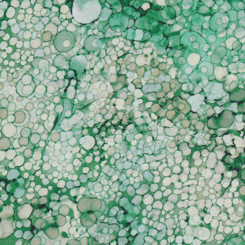 Tonal green and pale green marbled fabric with small circles all over