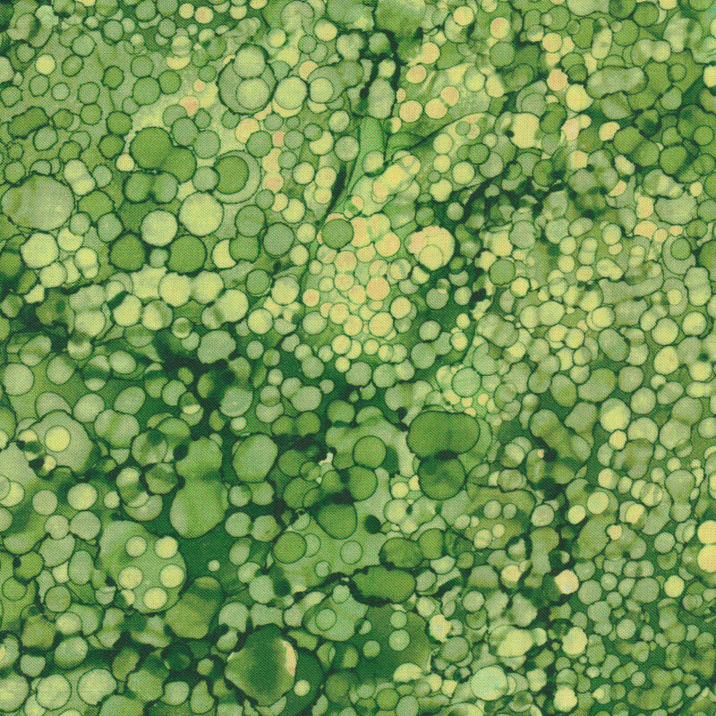 Tonal green fabric with light and dark green marbled designs