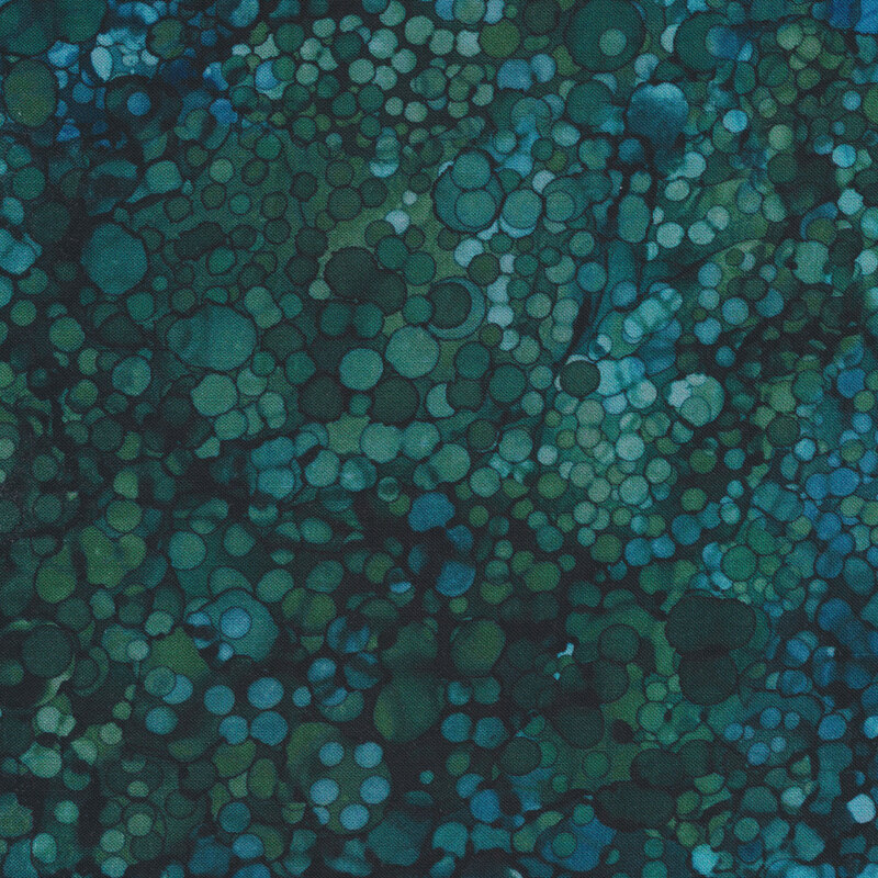 Dark teal and blue marbled fabric with small circles all over