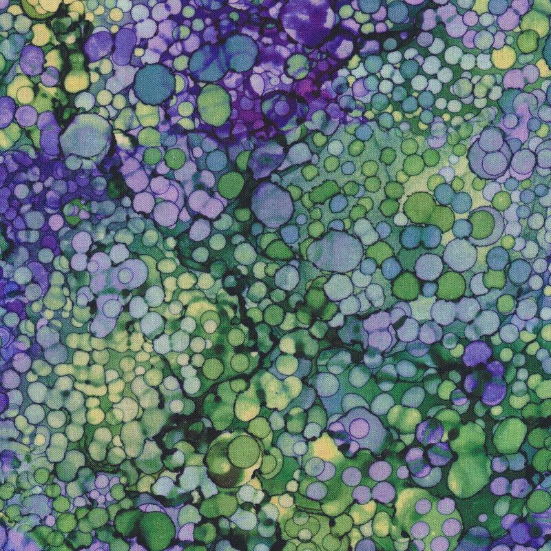 Purple and green marbled fabric with small circles all over