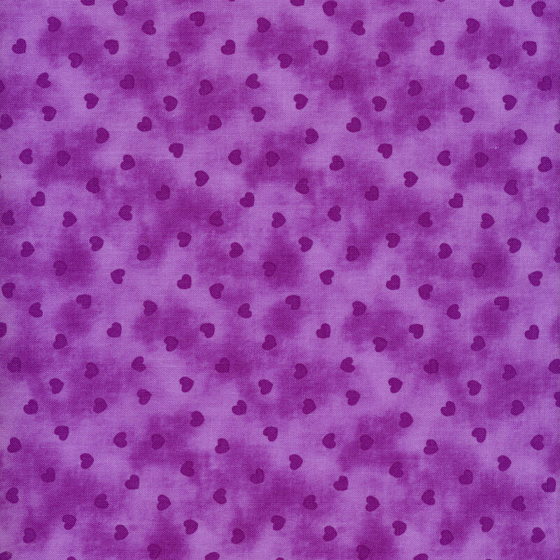 Dark purple hearts tossed on a mottled purple background