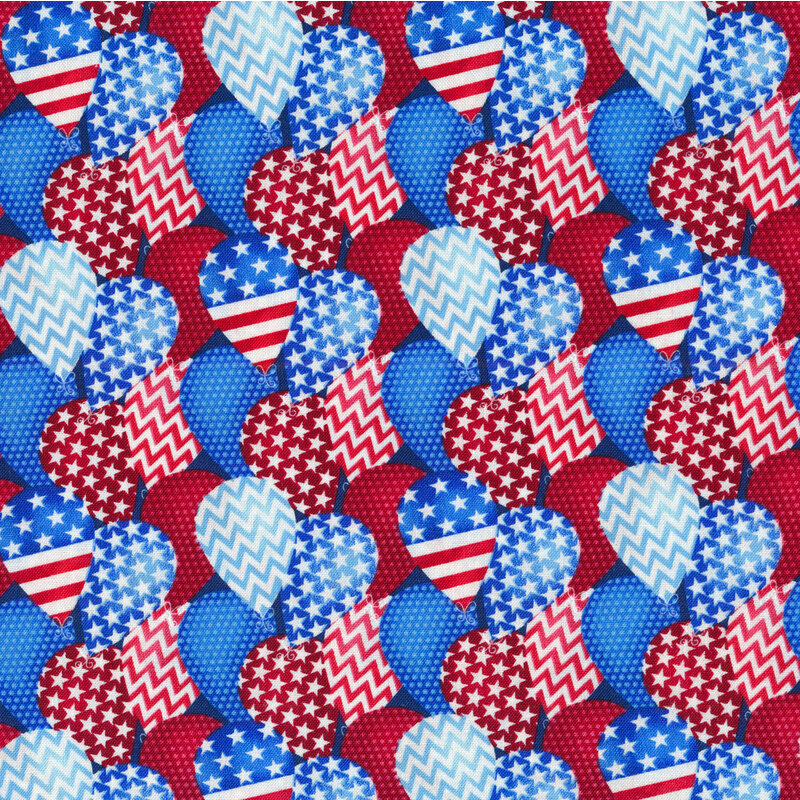 Patriotic red, white and blue balloons packed on a blue background