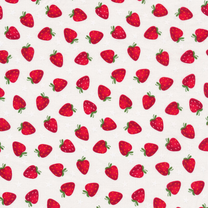 Tossed red strawberries and white stars on a white background