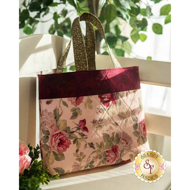 The beautiful Anastasia Fat Quarter tote resting on a bench
