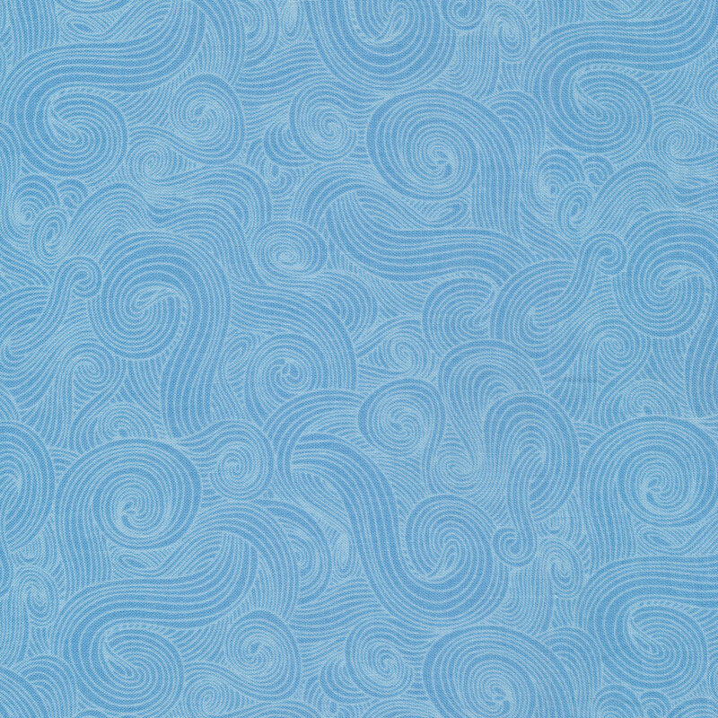 Tonal light blue fabric with dark swirls on a lighter background 