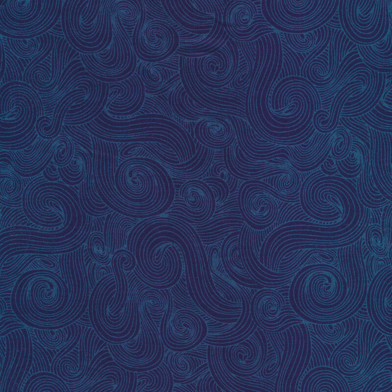 Tonal navy fabric with dark swirls on a lighter background 
