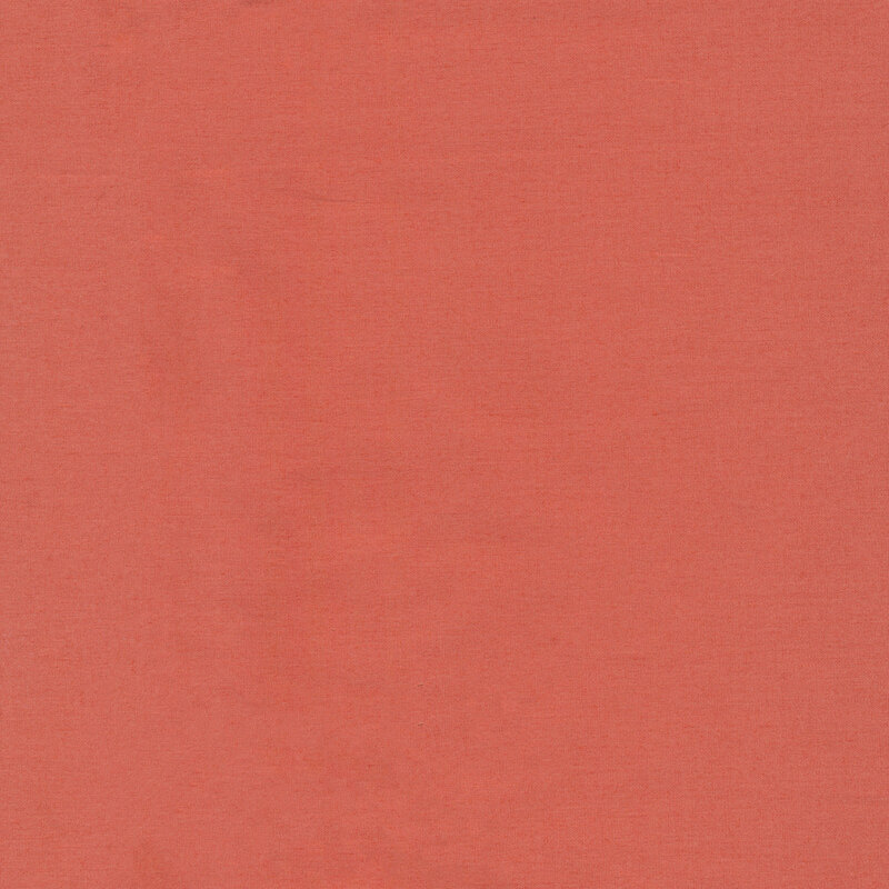 Solid peachy terracotta colored fabric