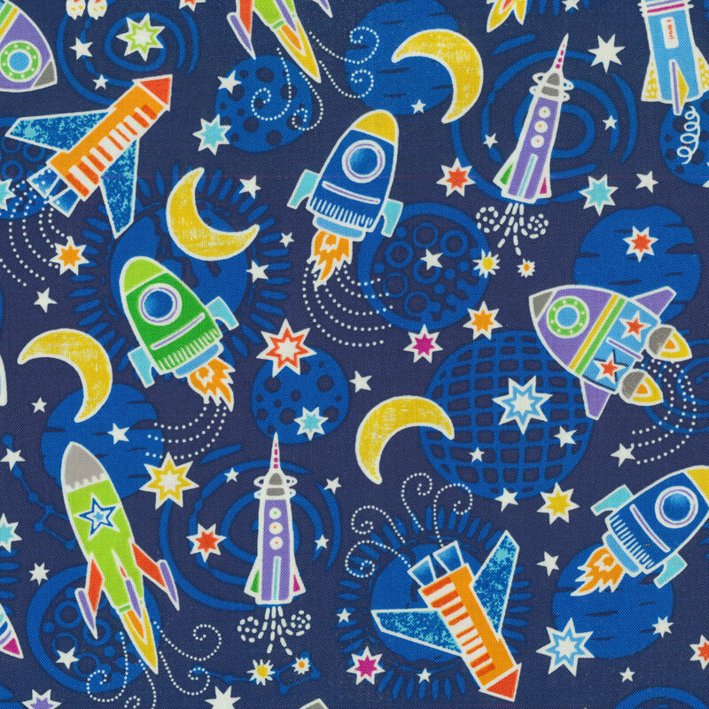 Spaceships and stars on a tonal blue fabric background