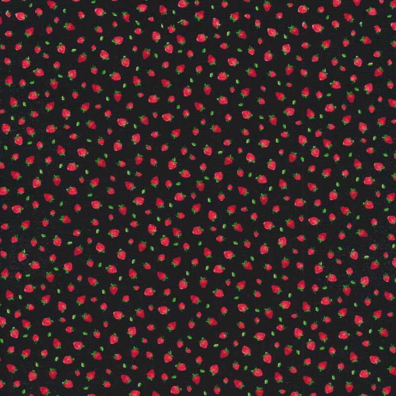 Small tossed strawberries on a black background