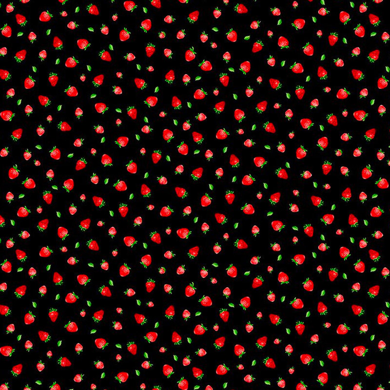 Small tossed strawberries on a black background