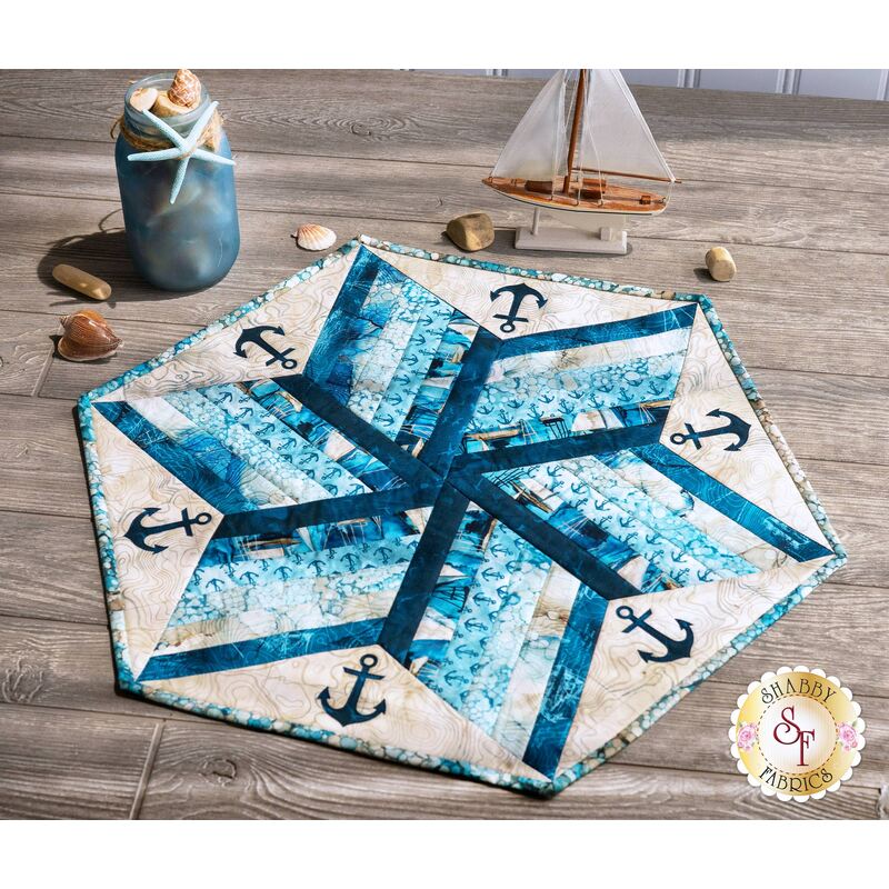A beautiful nautical themed 60 Degree Diamond Table Topper on a wood table