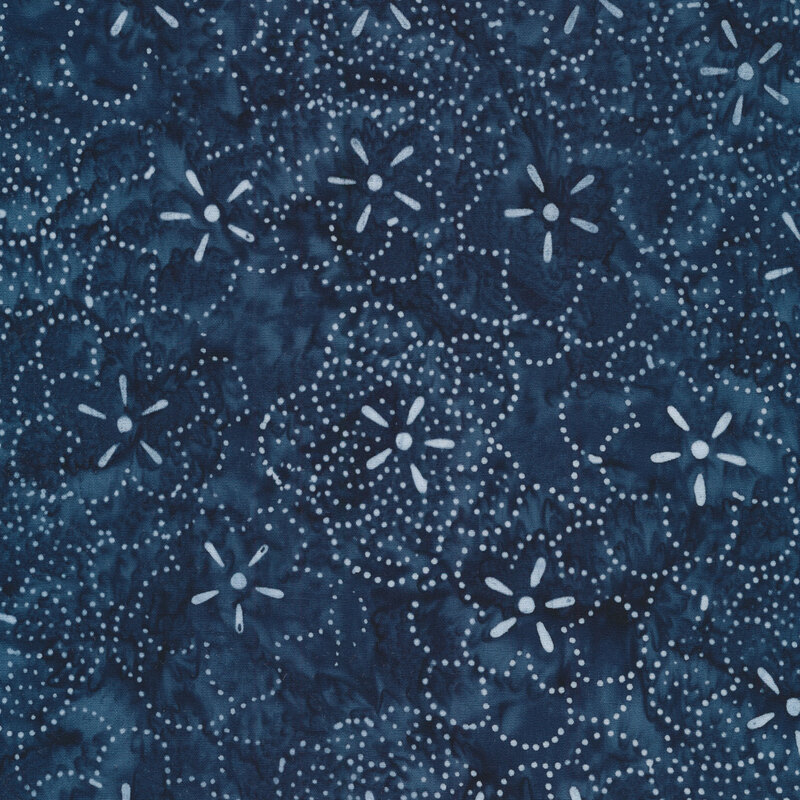 Small light blue flowers and dots all over a dark blue marbled background