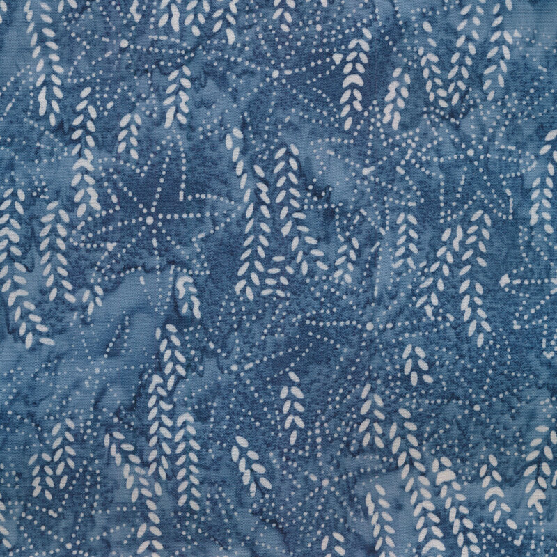 Mottled light blue leaves and vines with dotted stars on a dark blue marbled background