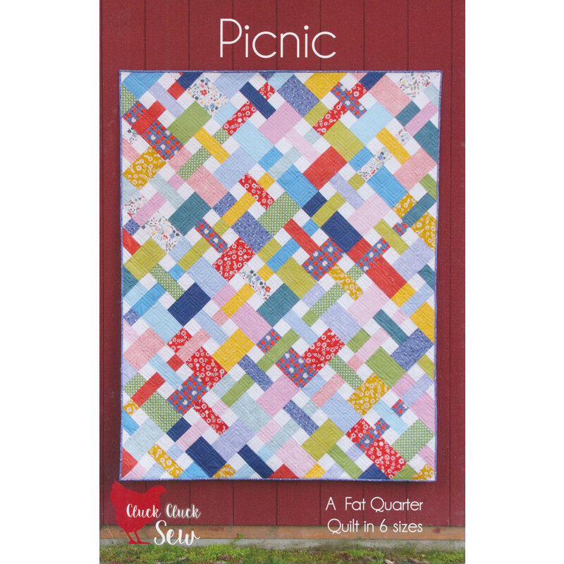 The front of the Picnic pattern by Cluck Cluck Sew showing the finished pieced quilt.