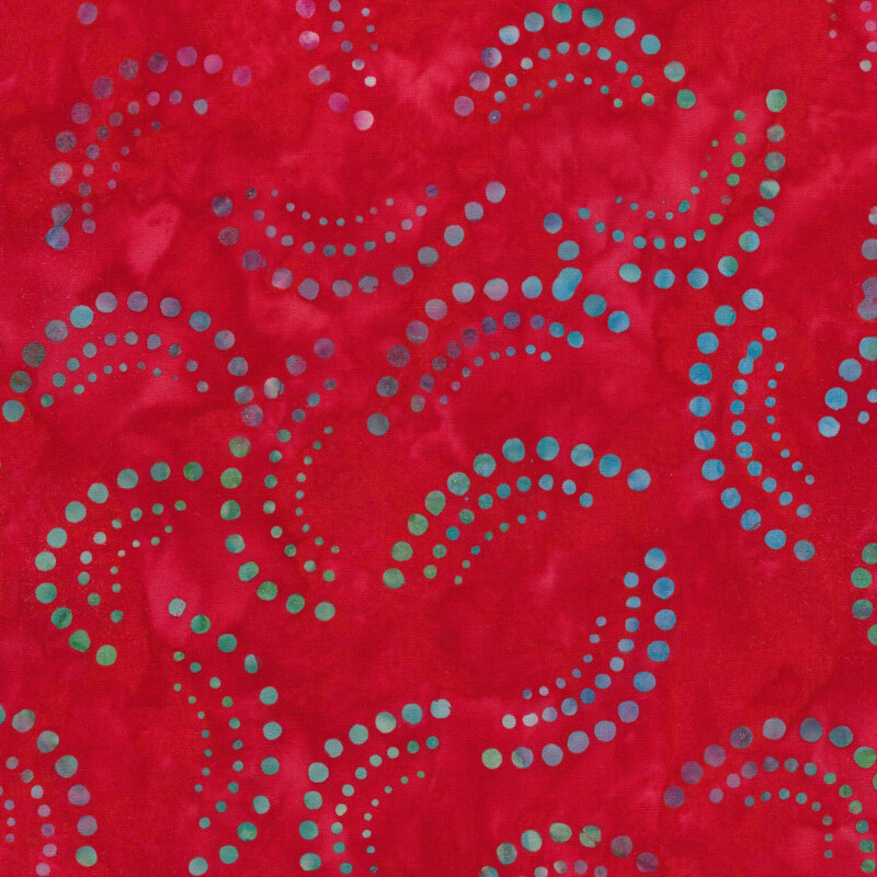 Multi colored fanned dots on a red mottled background