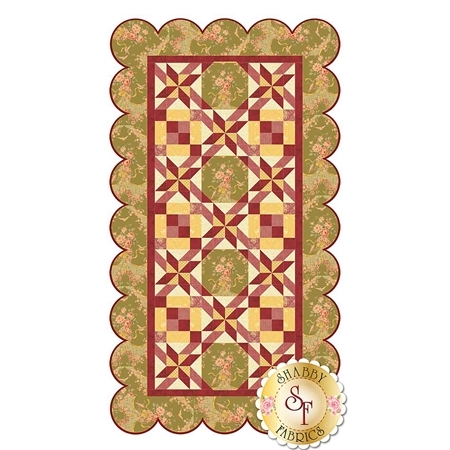 The English Garden Table Runner by Shabby Fabrics featuring patchwork blocks, spinning star blocks and a scalloped border.