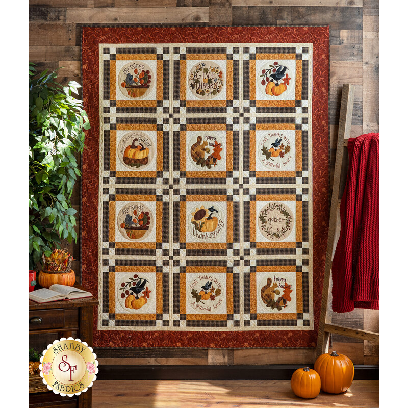 The adorable Blessings of Home Quilt Kit hung from a wall
