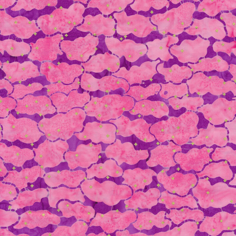 A pink cloud batik fabric with a mottled background and small golden metallic accents