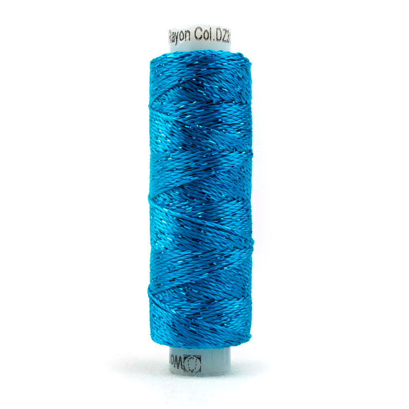 A spool of the WonderFil Dazzle 3132 - Blue Danube thread on a white background