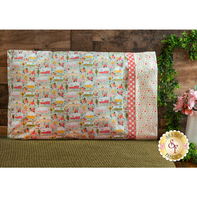 Pillow covered by a floral pattern and blue background pillowcase