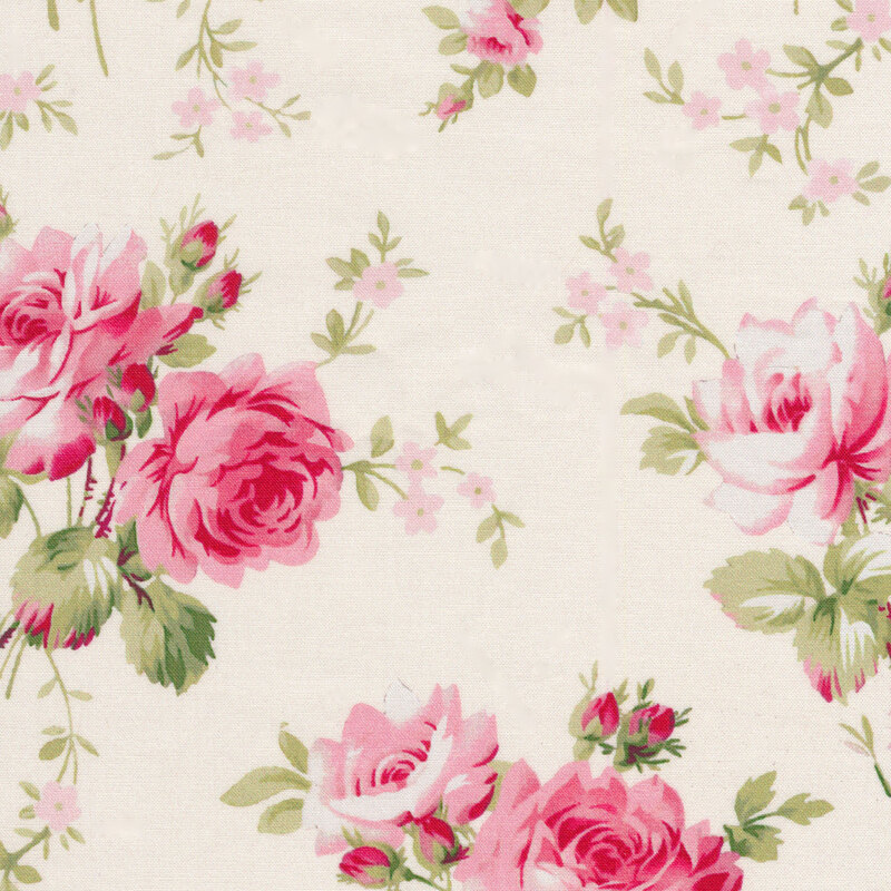 A cream colored fabric with tossed pink roses and small pink flowers