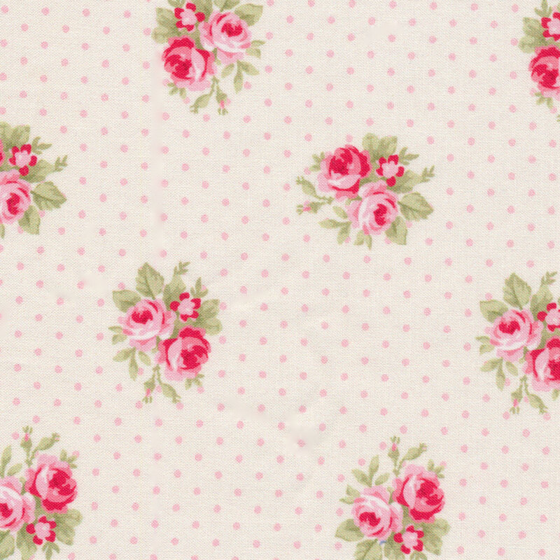 Cream and pink polka dot fabric with small rose designs throughout