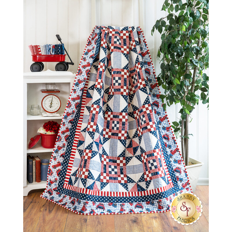 Red white and blue quilt draped over furniture.