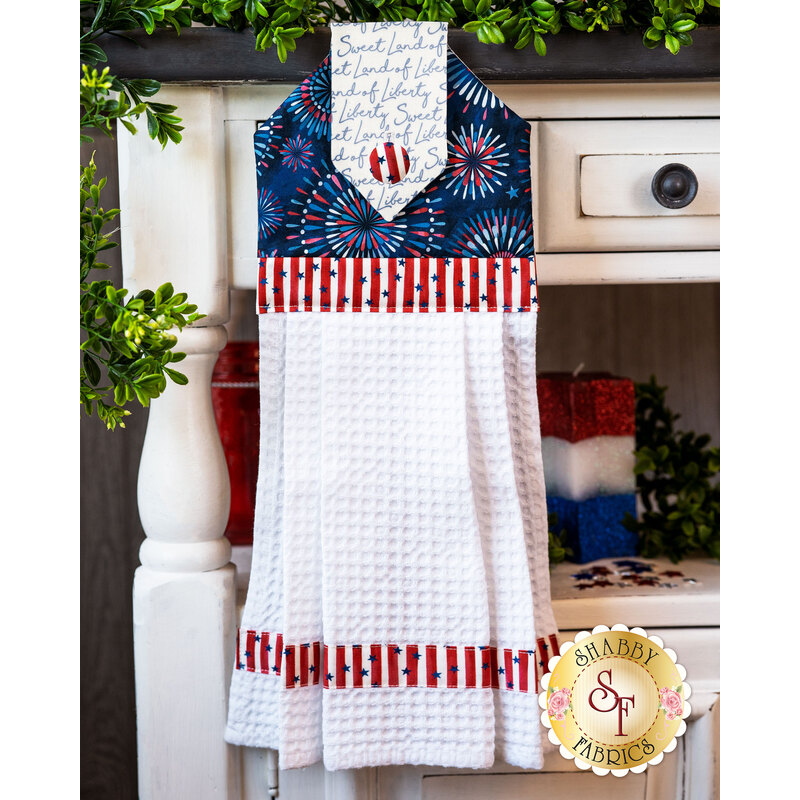 Hanging towel with firework motif and waffle textured fabric.
