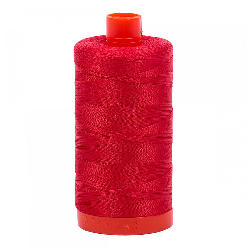 A spool of Lobster Red Aurifil Thread on a white background