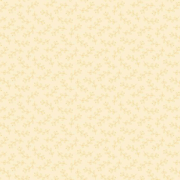 Tonal fabric with tossed leafy vines all over a cream background