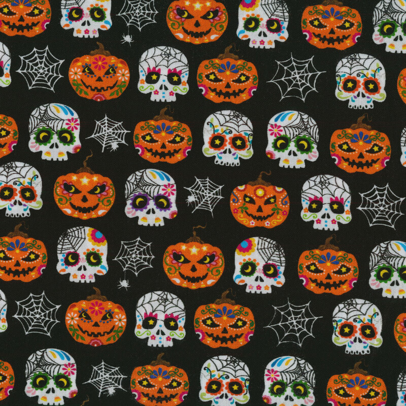 Black fabric with sugar skulls, Halloween pumpkins, and spider webs