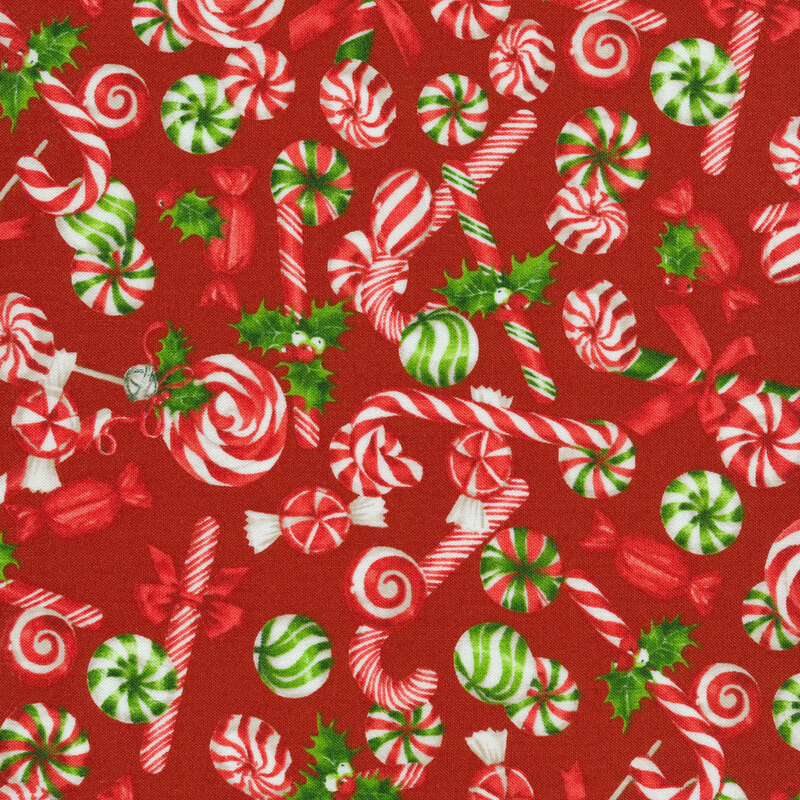 Red fabric with novelty peppermint candy and candy canes in red and green