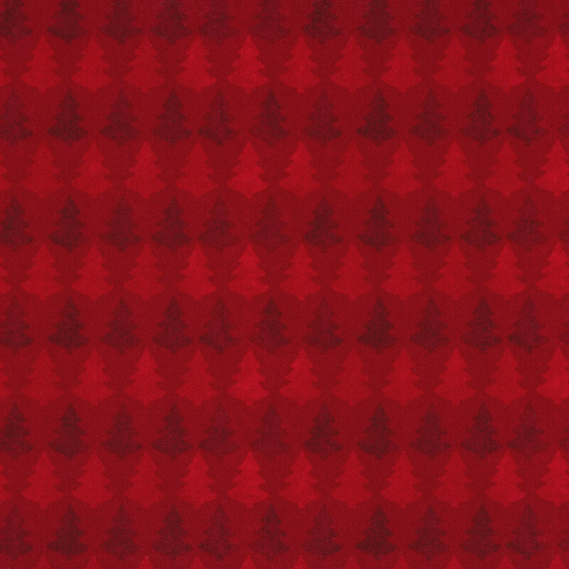 Fabric with rows of light and dark red trees on a red background