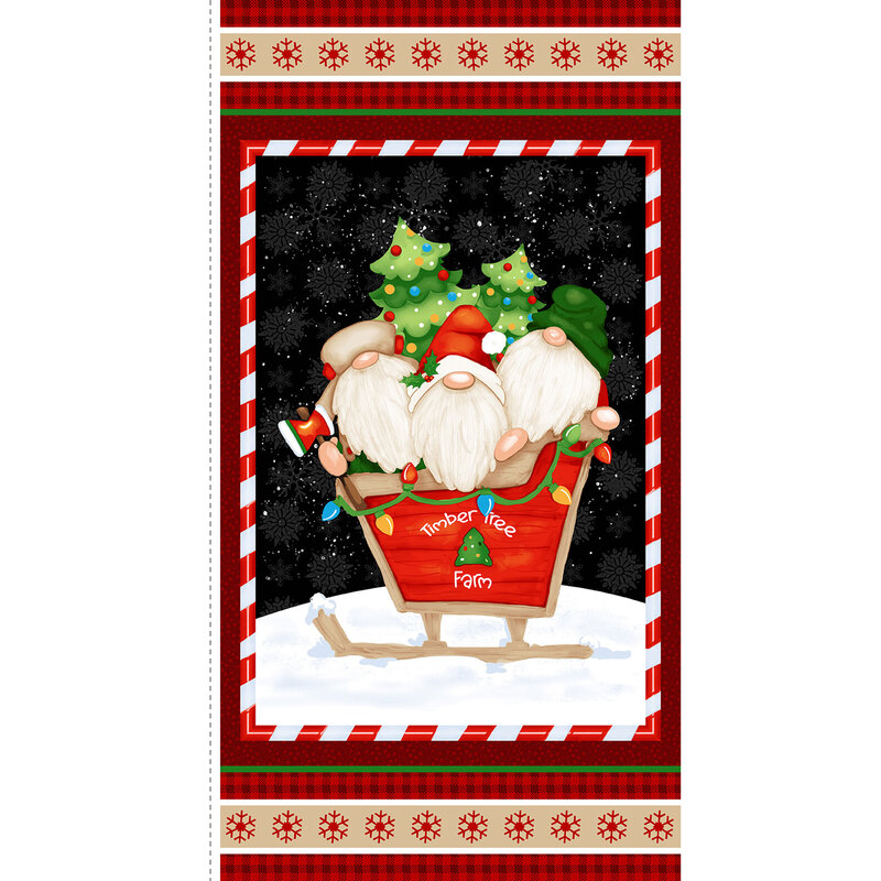 A Christmas fabric panel with gnomes in a sleigh with Christmas trees