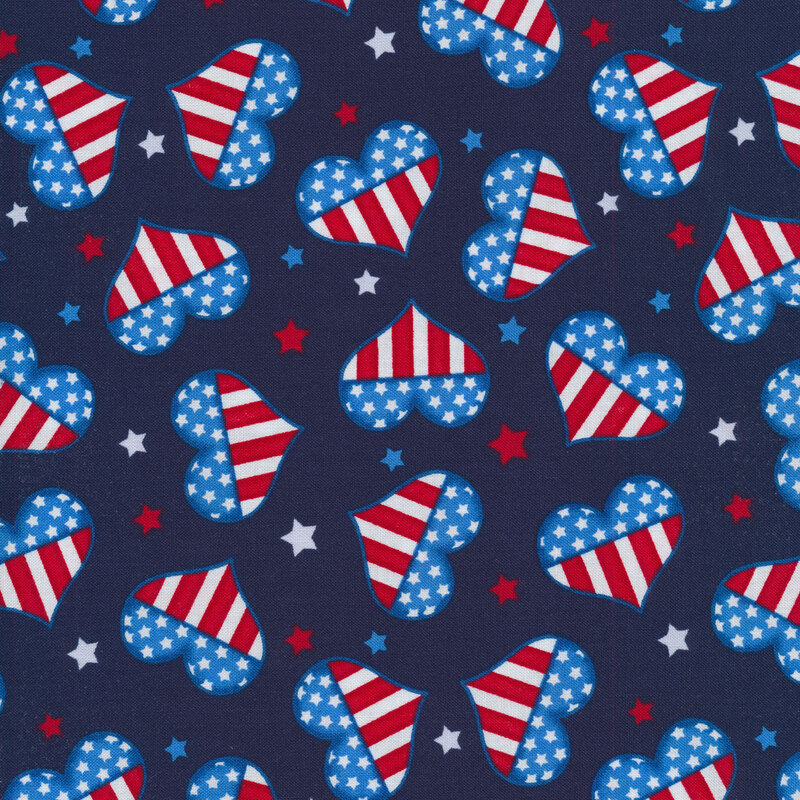 American flag colored hearts and small red, white, and blue stars tossed on a navy background