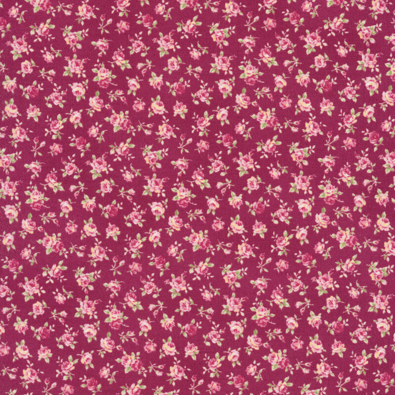 Floral fabric with tossed pink ditsy roses on a dark pink background